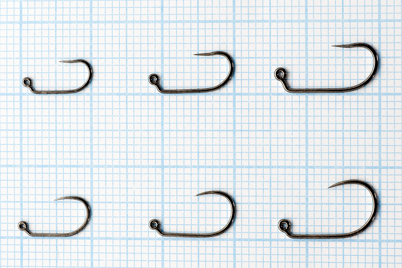 Popular barbless jig fly hooks on millimeter paper